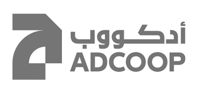 Gray logo of ADCOOP with Arabic text on a white background